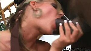 A busty blonde gives her first deepthroat to a well-endowed black man